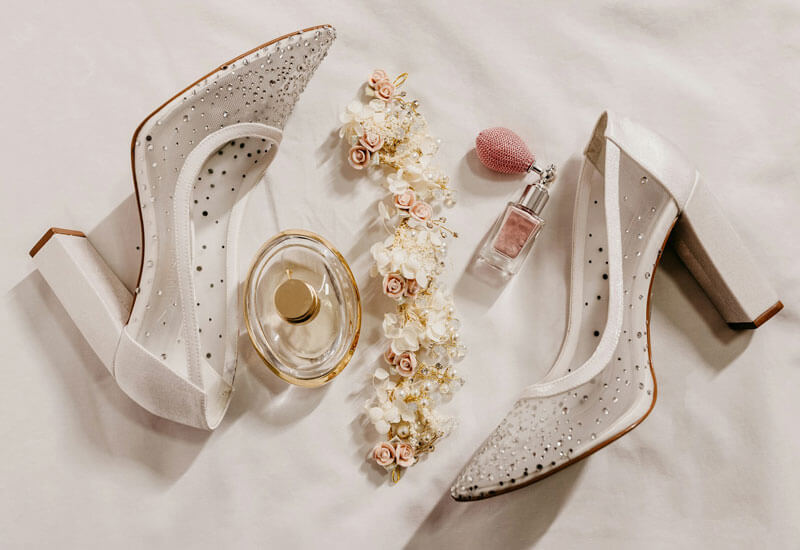 A pair of High Heel with perfume and Flowers Image
