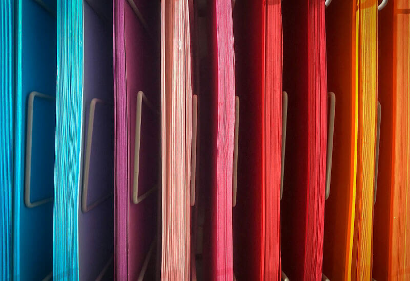 A pile of Assorted colored Papers Image