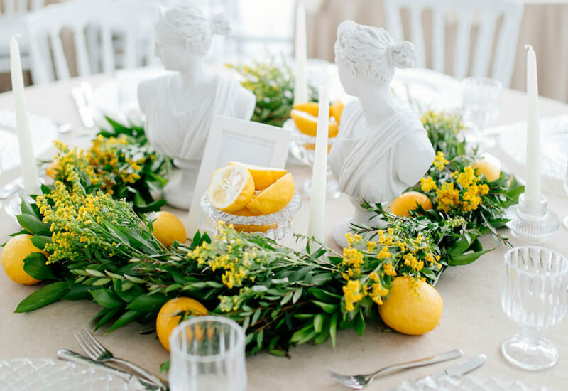 A Table with Lemons and Greenery Image