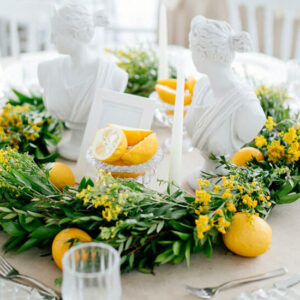 A Table with Lemons and Greenery - Image