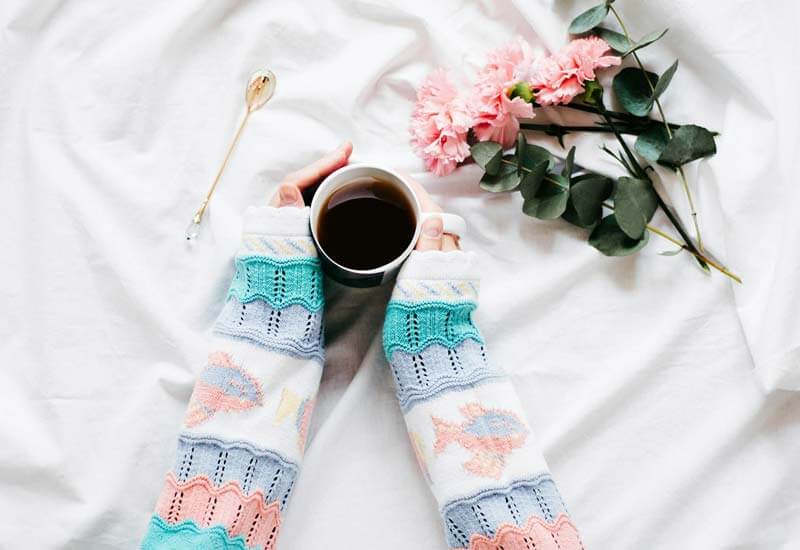 A Woman Holding Mug Image