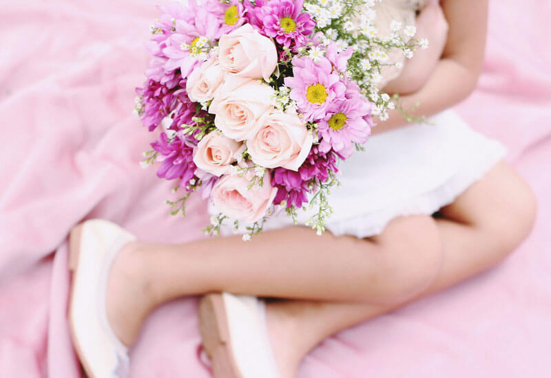 Girl Sitting with the Flowers Image