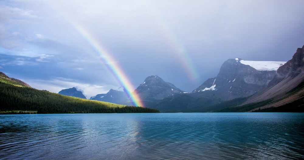 Rainbow on Hills and river in the monsoon season