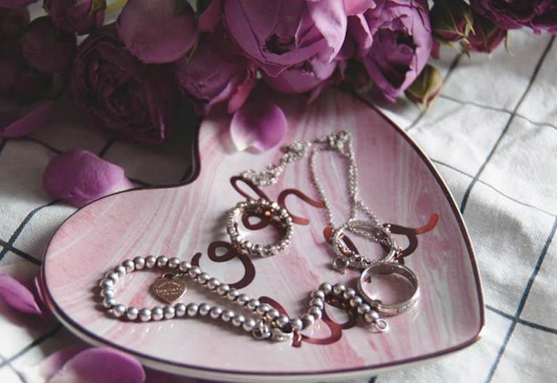 Silver Jewelry on the plate Image
